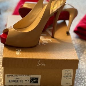 Christian Louboutin Vendome slingback red peep toe pumps.